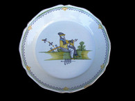 18th century English delftware plate decorated with Chinese figure of man with axe, ca. 1720 – 1750