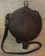 Original and complete Civil War maker-marked canteen, with leather strap