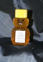 A two ounce bear shaped jar of Monastery Honey