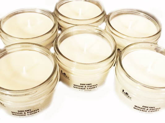 DREAMY MASSAGE CANDLES:  This candle serves as an intimate escape for couples to enjoy a romantic and sensual experience or for individuals to enjoy a quality spa massage experience.  This fragrant candle will set a relaxing mood while lightly scenting the room.  Once the oils have melted, then treat yourself to a relaxing massage.  These delightful massage candles (solid massage oil) serve this dual purpose.  We can all agree that a massage is a wonderful way to relax your body; couple that experience with a fragrant candle--when lit--provide a scintillating aroma to any room, allowing anyone to renew the mind, and revive the spirit.  Directions:  Carefully light the wick of the candle with a match or a lighter.  Allow the massage oil-wax mixture to melt a pool of oil over the entire top of the candle.  Blow out the candle and carefully pour the oil and massage into the chosen body part.  The heated massage oil-wax mixture will create a warm massage.  Trim the wick prior to re-lighting the candle.  Do not burn for more than one hour at a time.   Ingredients:  Each massage candle is made with a blend of natural soy wax, a proprietary butter and oil blend containing pure african shea butter, mango butter, organic raw coconut oil, monoi butter, avocado oil, beeswax, and vitamin E, and essential/fragrance oils.  Directions:  Carefully light the wick of the candle with a match or a lighter.  Allow the massage oil-wax mixture to melt a pool of oil over the entire top of the candle.  Blow out the candle and carefully pour the oil onto hands and massage into the chosen body part.  The heated massage oil-wax mixture will create a warm massage.  FOR EXTERNAL USE ONLY.  Available in 4 oz. (113 g) and a variety of scents.

CAUTION:  Always use caution when lighting a candle.  Do not keep candles lit that are unattended.  Keep out of reach of children and pets.  Keep away from items that may catch fire and clear of drafty areas. Those with sensitive skin or allergies should be sure to do a patch test on the inside of your forearm, (where the skin is most delicate and similar to your skin on the face), to make sure the skin does not have an adverse reaction to the ingredients used in the formation of this product.