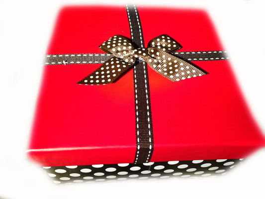 Gift wrap your order.  The gift is wrapped lovingly in a box with a ribbon and a card that contains the content of the package.  You can even add a special message!  The picture is a sample of our gift wrapping.  We reserve the right to gift wrap the items to best suit the order, time of year, and occasion.