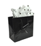 Black Glossy Solid Color Tote Bag with decorative tissue paper protruding from bag