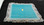 Turquoise Terrycloth with White/Silver Lace and Gold Cross