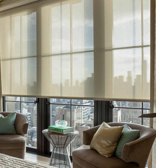 Transparent curtains over a window with a view of the city line