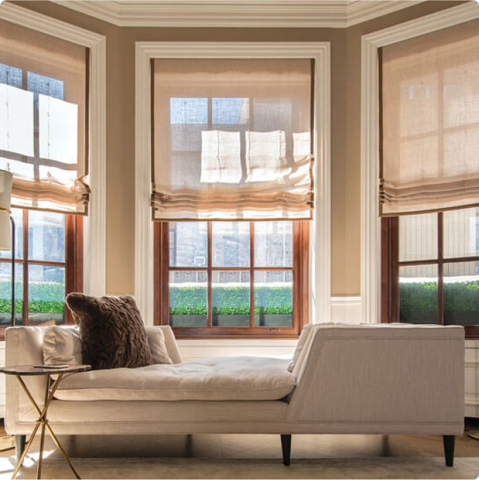 Transparent curtains over a window with a view of the city line