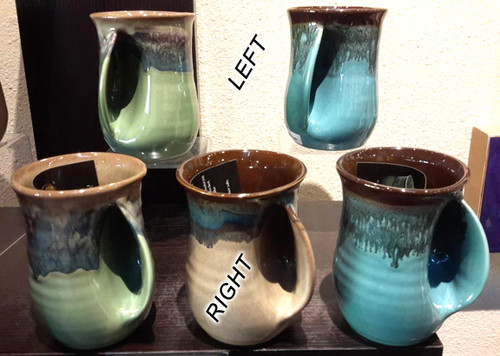 This 14oz. Handwarmer Mug is available with right-handed or left-handed pockets. Please call the gallery for availability and to purchase.  