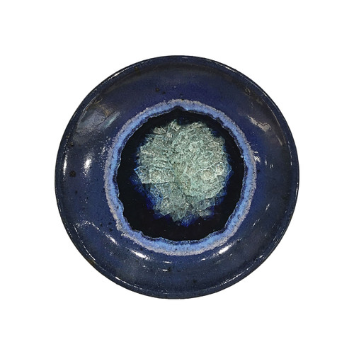 Wasa Cup in Blue by Kerry Brooks Pottery.  Ceramic small dish with Geode Style Fused Glass in Blue. These awesome glass dishes are decorative and functional. The perfect holiday, wedding, graduation, or hostess gift!

Each wasa cup is 4.25" in diameter and 0.25" deep. Some variation in color is due to the handmade nature of these items.
(Does not contain actual geodes.) 

Pottery with fused glass is food safe in the way that it is not toxic in any way. However, that neat little crackle pattern is really a bunch of cracks and food particles may find their way into the cracks, leaving a stain or allowing bacteria to grow. Therefore, we tell our customers that the “glass pots” are for dry foods only, such as bread, cheese, grapes, etc. They should be hand washed after use & often are described as decorative only.