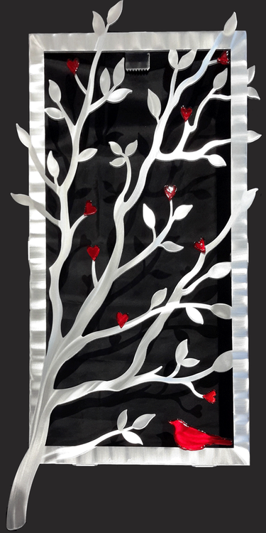 Window View - Red, 15"x30" by Sondra Gerber.
Hand brush aluminum wall Sculpture with glass inclusions.  The use of positive and negative shapes within the intricate cut of the designs cast alluring shadows that interact with the piece itself.