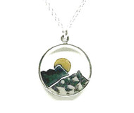 A delightful 0.75" Mountain themed pendant necklace by Athena Designs. This pendant has an oxidized layer which creates depth and 14kt gold makes the moon glow over the peak. The sterling silver chain as a finished length of 15" with a 1.5" extender.