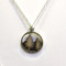 This 15mm circle pendant by Athena Designs is a wonderful piece for any tree lover. Two tall pine trees adorn an oxidized mountain background. The sterling silver chain as a finished length of 17" with a 1" extender.