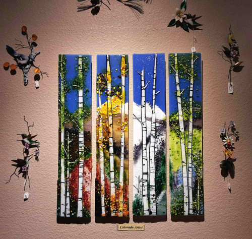 Four Seasons - 4 piece set by Kathi D Dougherty portrays all the seasons in individual panels to create a dramatic scene in fused glass.