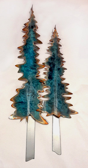 This Pine tree duo wall art by Greg Gowan is made from torch cut copper and steel. Dimensions: 11" x 25" x 2".  Three Patina trees.