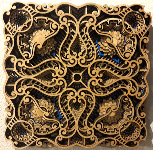 'Zephyr" by Philip Roberts is a 12 Layer wood wall piece measuring approximately 16" x 16". 