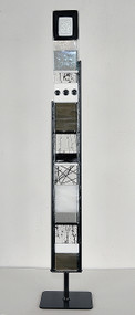 Small Standing Totem in Black and White by Hands On Art Glass. 3"x27", fused glass in a black metal stand. Please call our galleries to see which pieces are currently on hand. 