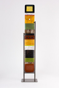 Large Standing Totem in Earth by Hands On Art Glass. 5"x36", fused glass in a grey metal stand. Please call our galleries to see which pieces are currently on hand. 