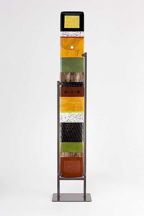 Large Standing Totem in Earth by Hands On Art Glass. 5"x36", fused glass in a grey metal stand. Please call our galleries to see which pieces are currently on hand. 