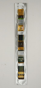 Wall Totem in Earth by Hands On Art Glass. 2"x24", fused glass on aluminum. Please call our galleries to see which pieces are currently on hand. 