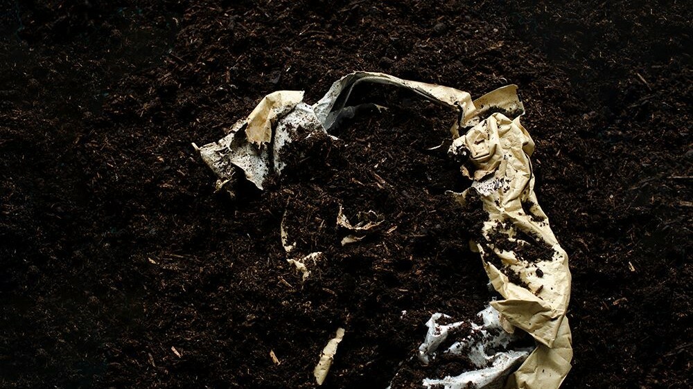 Compostable Pouch biodegrading in compost