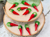 Red chili peppers are used as decorations during Chinese New Year to symbolize good luck, prosperity, and to ward off evil spirits