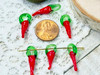 These charms measure on average 5x21mm (including their green loop)