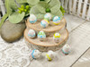 White eggs with pink, blue, yellow & green designs - 14x15mm - 1mm Hole 