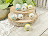 White eggs with pink, blue, yellow & green designs - 14x15mm - 1mm Hole 