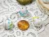 White eggs with pink, blue, yellow & green designs - 14x15mm - 1mm Hole 