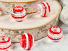 Thin Red & White strips of glass embellish these clear round lampwork beads