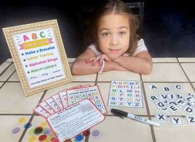 Our new kidergartner getting ready to  learn her ABC's