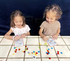 Playing Bingo with her little sister