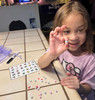 Showing off her letter beads