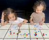 Learning letters as they play