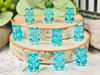 Add a aqua blue gummy bear to an Easter Candy beaded bracelet