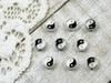 Tiny treasures of black & white enamel surrounded by silver plating