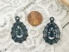 These black enamel on metal charms measure 21x34x4mm and have 2.5mm charm loops