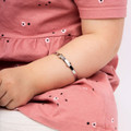 Child wearing silver bracelet B5060