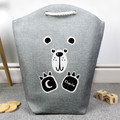 Black and white bear toy and laundry basket