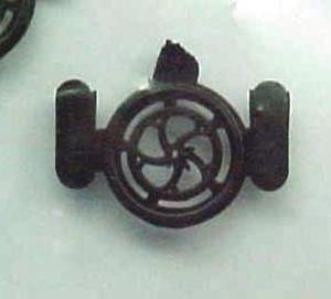 Picture of single brake wheel in as molded outer ring. There are five tabs that must be cut and trimmed from actual wheel detail part.