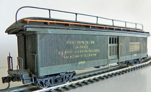 Built-up model (3168) with roof walk and railing added, painted, lettered, with trucks and 
Kadee couplers.