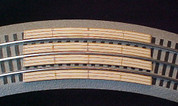 48" Curved crossing for Lionel Fastrack Sectional Track.  Makes One (1) two (2) lane automobile crossing for road across track.
See other listing for special Auto Ramps for this crossing. 
 Smooths the transition for cars to cross tracks.