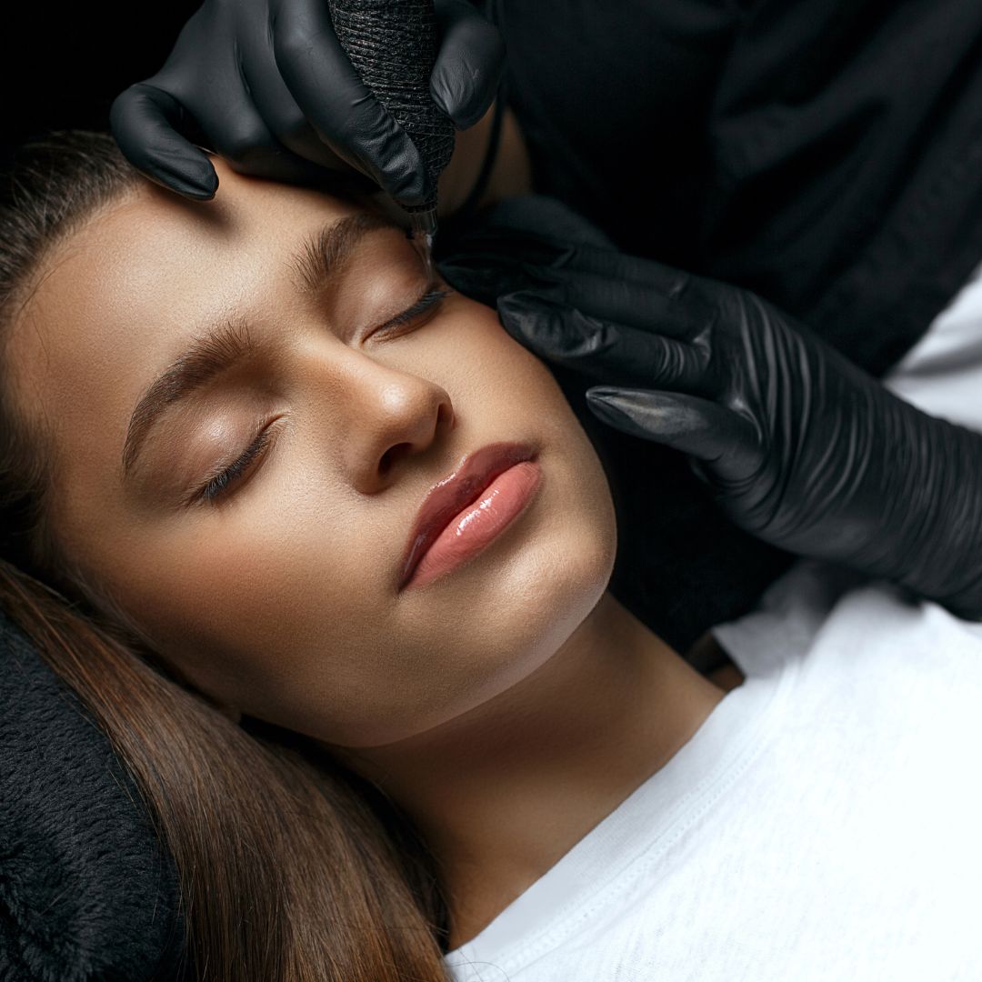 woman getting permanent makeup applied