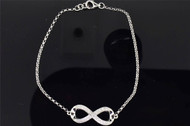 Ladies 10K White Gold White Diamond Infinity Love Designer Charm on Bracelet