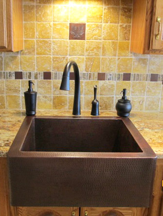 25" Hammered copper farmhouse sink installed as top mount