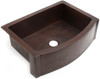 Side view of rounded front apron copper sink with flat ends.