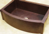Rounded front copper farmhouse kitchen sink.