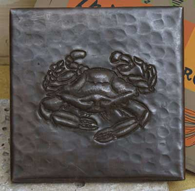 Crab design on hammered copper tile
