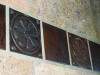 Daisy Circle hammered copper tile installed with TL314 hammered copper tile