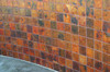 Fired hammered copper tile on outside wall