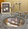 Shiny hammered brass round sink