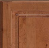 Corner of a KraftMaid cabinet door showing Alder wood in Ginger finish